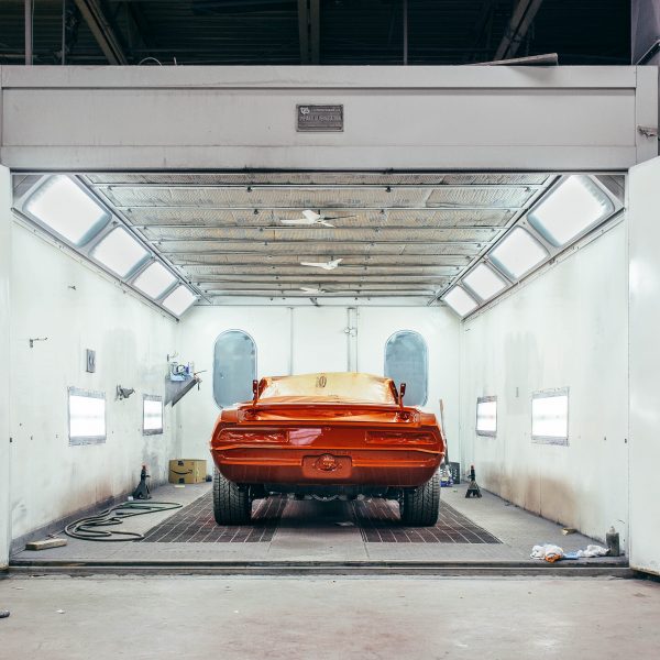 red car in spray booth